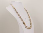 Ivory and sterling silver colored necklace with antique gold beads.