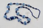 Handmade cobalt and white glass bead necklace with lapis lazuli.