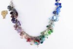 Handmade sterling silver chain necklace with a multi color collage of semi precious stone and glass beads.