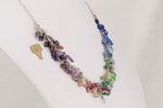 Multi color semi precious stone and glass bead necklace on sterling silver chain.