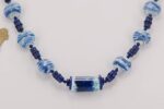 Cobalt blue and white glass bead necklace with lapis lazuli.