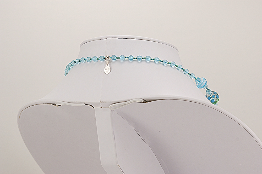 Handmade glass beaded necklace in turquoise and teal ocean colors.