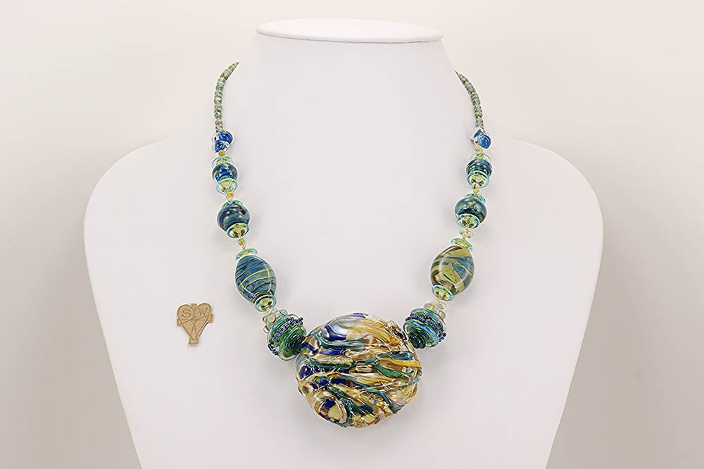 necklace with ocean hued colored glass beads in blues greens,turquoise and soft beige