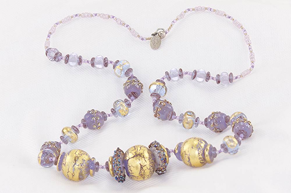 Lavender glass beaded necklace with 22 karat gold and sterling silver accents.