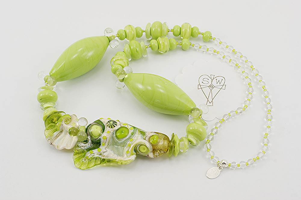 Necklace made from lime green and ivory colored Italian Murrini glass beads.