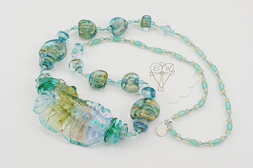 necklace with ocean colored glass beads accented with silver and gold dust