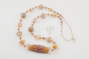 peachy colored glass bead necklace