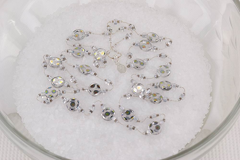 Silver reflective glass bead necklace with mercury beads.