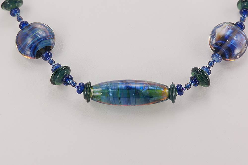 Blue and purple opalescent glass bead necklace.