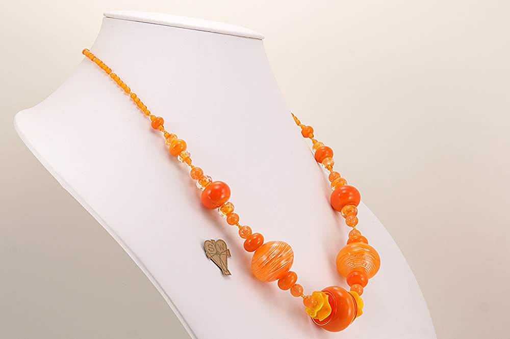 Necklace with bright orange glass beads.