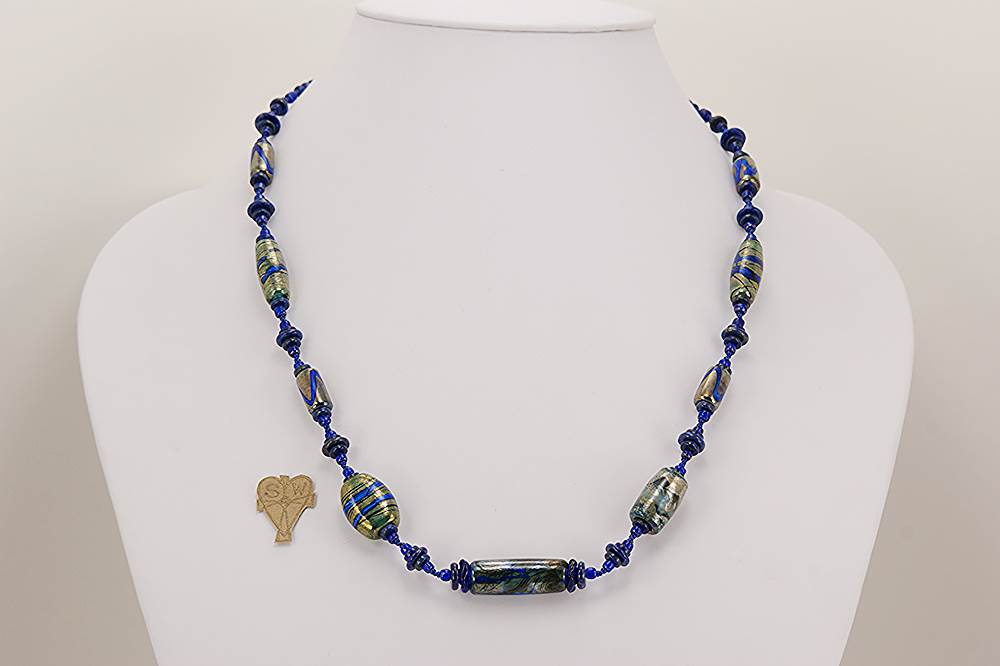 Cobalt blue colored glass bead necklace with silver metallic effect.