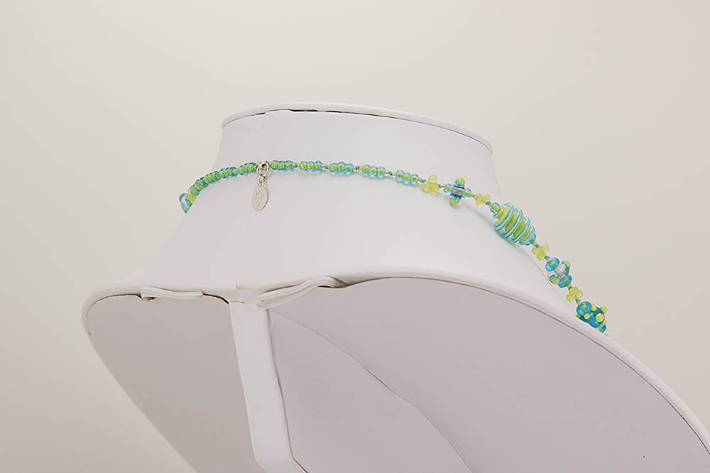 Bright light green, turquoise and clear glass necklace.