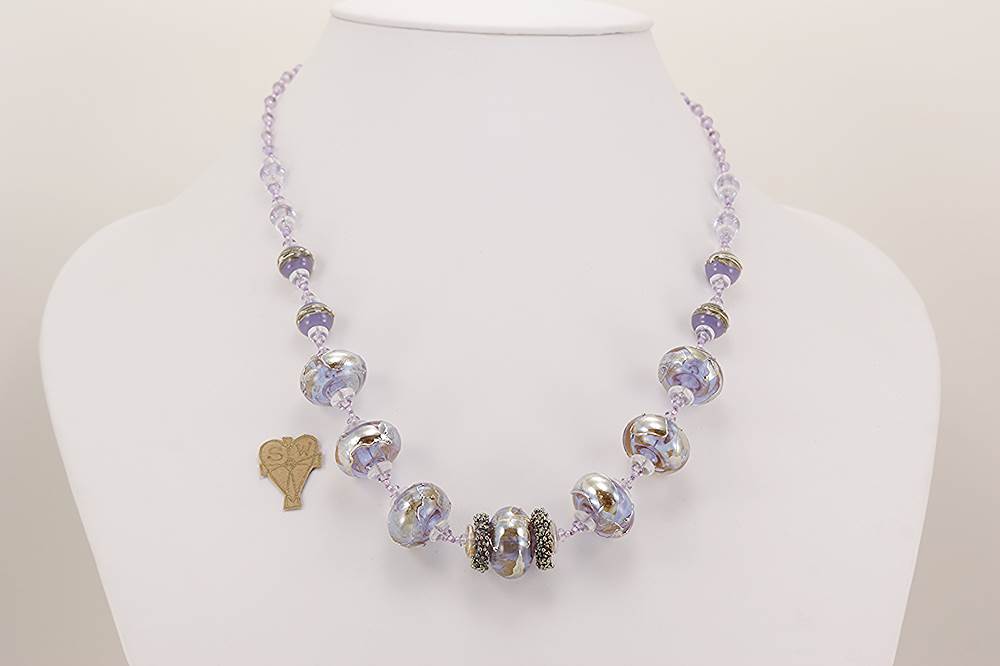 Handmade lavender, violet, heffalump colored glass bead necklace with sterling silver overlay.