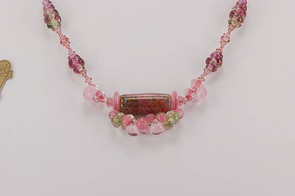 Deep pink glass bead necklace.