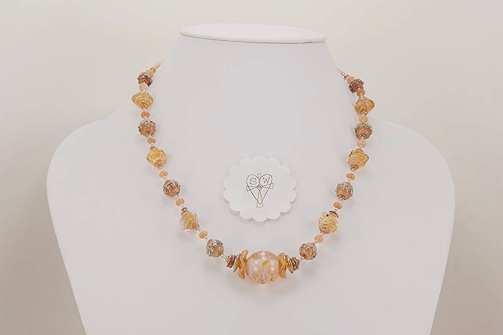 necklace made of rose quartz and opalescent blush glass beads