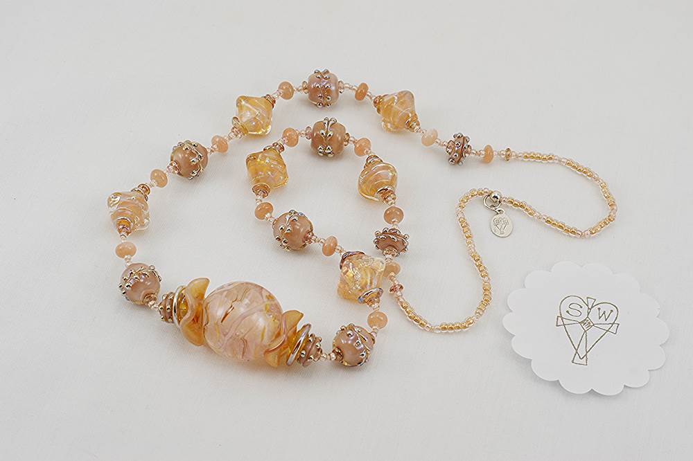 necklace made of rose quartz and blush opalescent glass beads