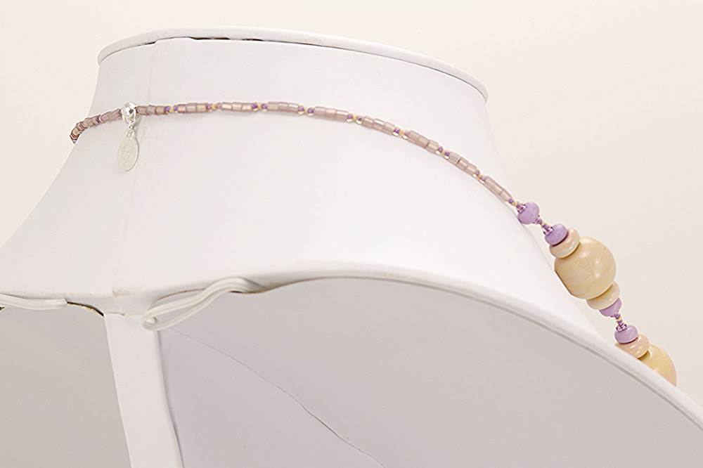 Purple, Mojave sugilite, turquoise beaded necklace with orchid and beige colored glass beads.