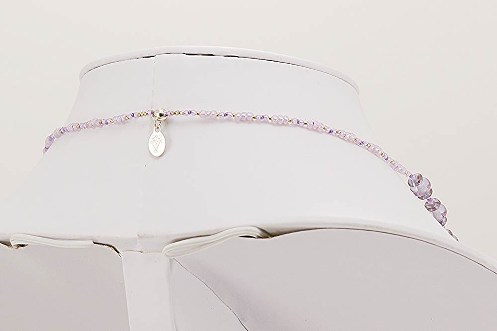 Lavender glass bead necklace with 22 karat gold and sterling silver accents.