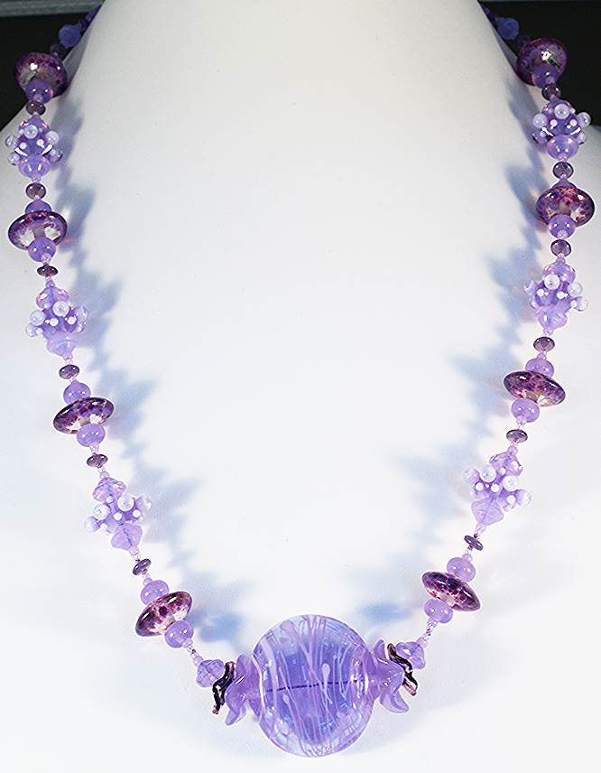Heffalump and lavender glass bead necklace.
