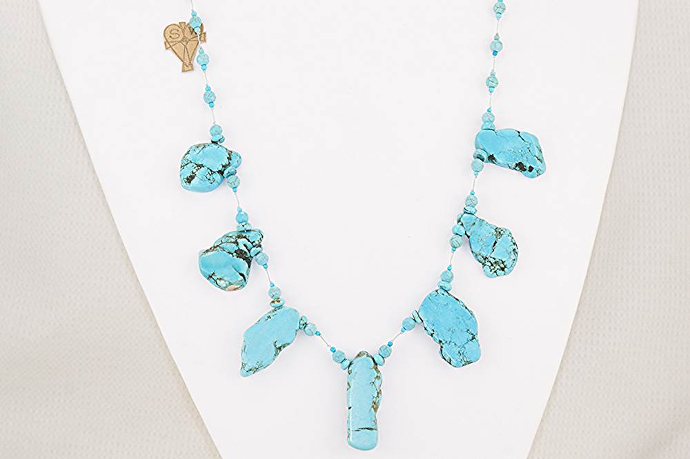 Handcrafted turquoise slab necklace.