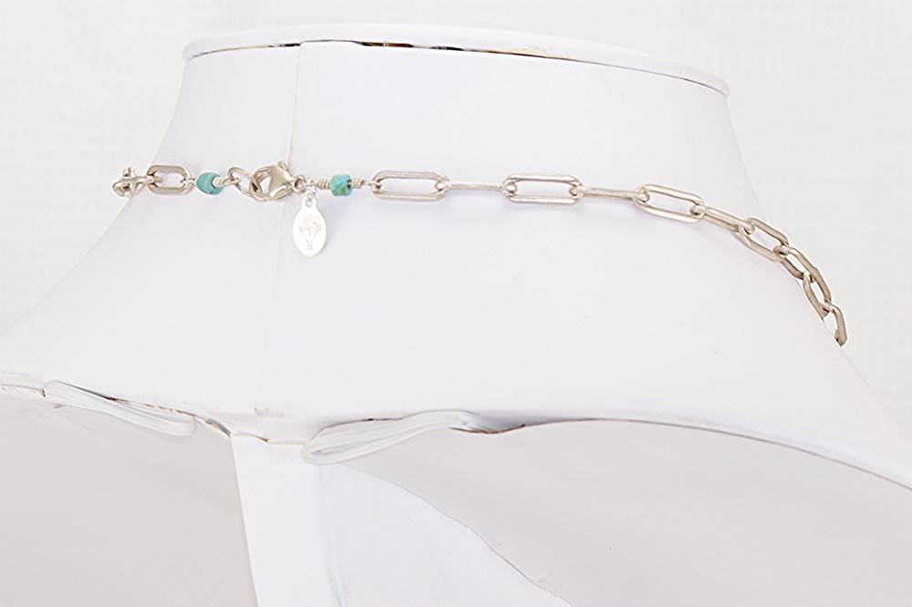 Handmade statement necklace with vintage turquoise trade beads hand wrapped to sterling silver chain.