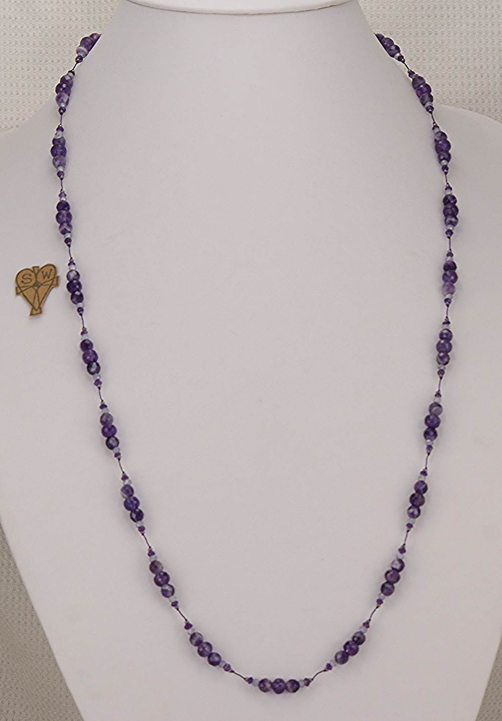 33 inch long, amethyst and quartz necklace.