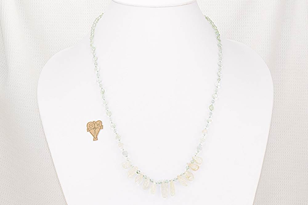 Faceted, green, moss agate and rutilated quartz necklace.