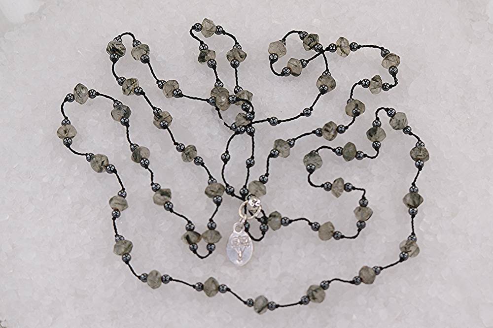 Faceted, rutilated, smokey black quartz and hematite necklace.
