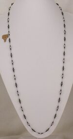 42 inch long smokey and clear rutilated quartz , black spinel and hematite beaded necklace.