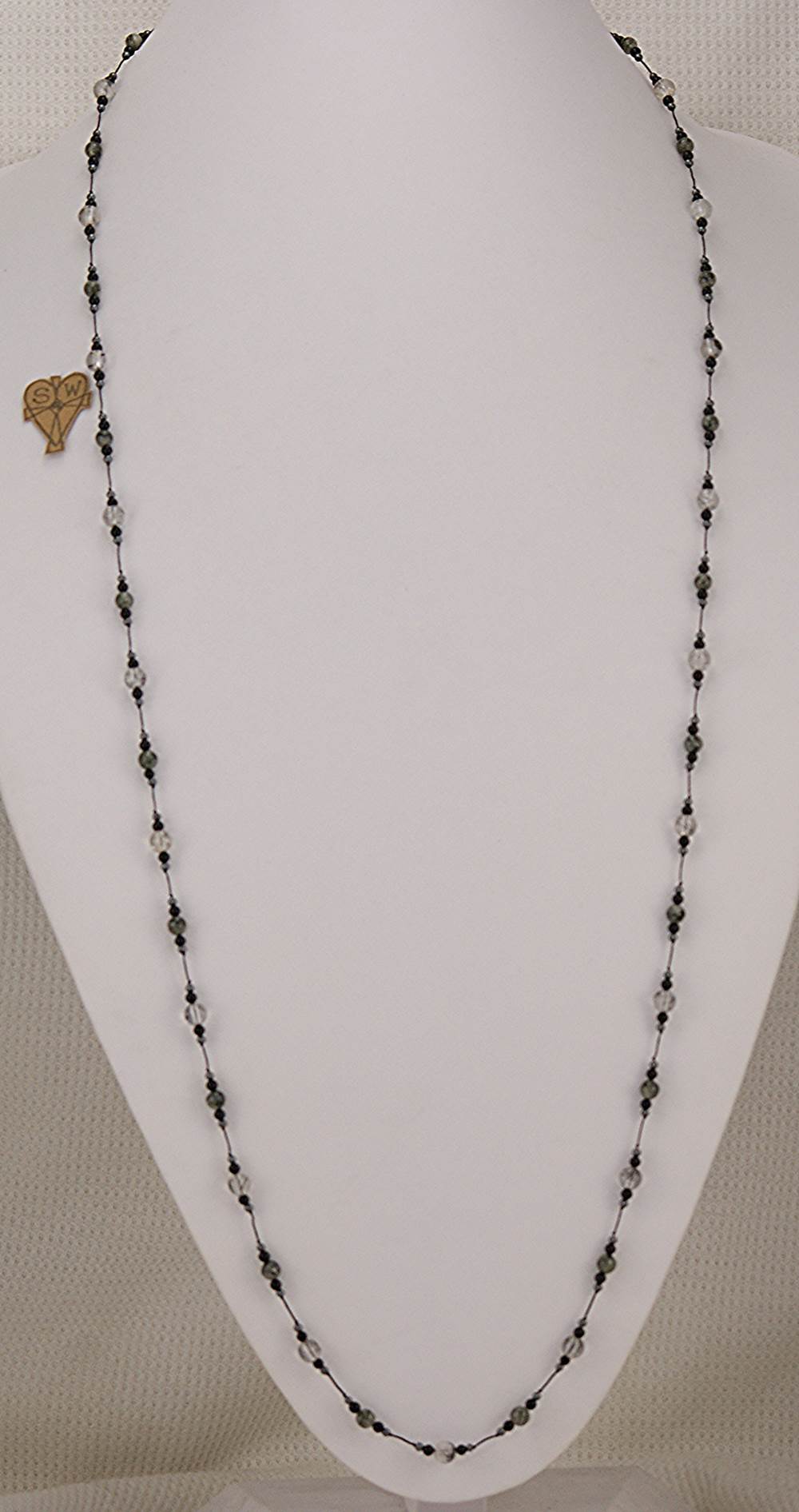 42 inch long smokey and clear rutilated quartz , black spinel and hematite beaded necklace.