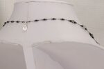 Smokey and clear rutilated quartz necklace with hematite and black spinel.