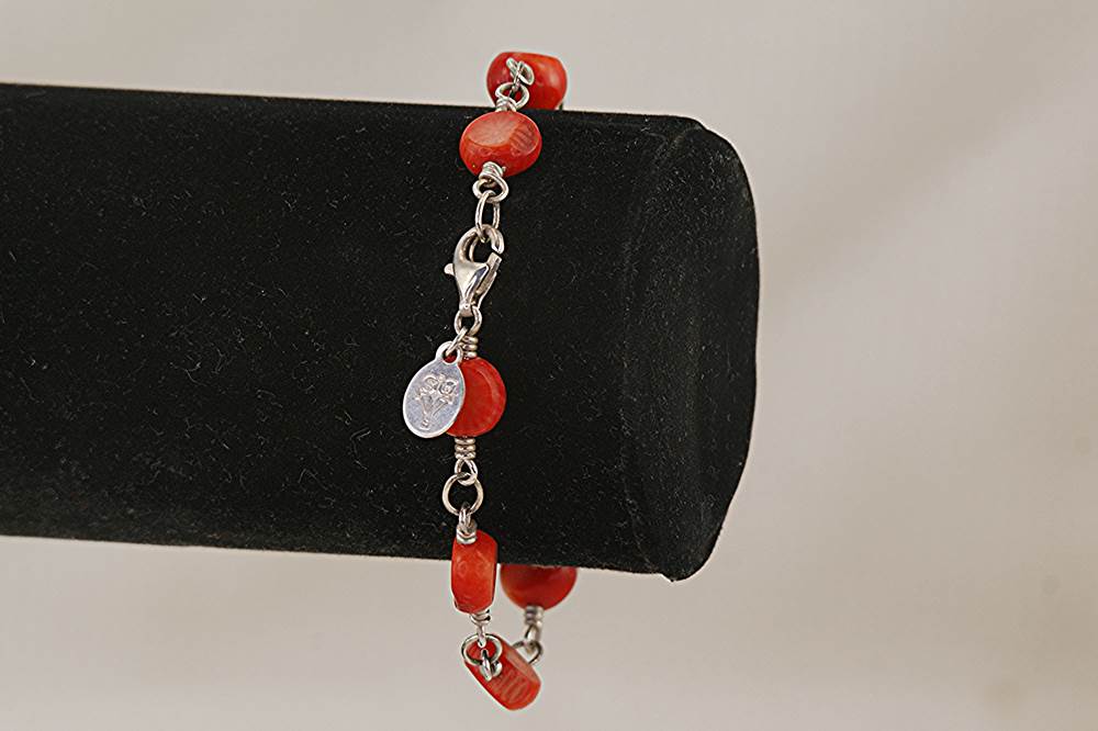 Handmade sterling silver bracelet with red bamboo coral beads.