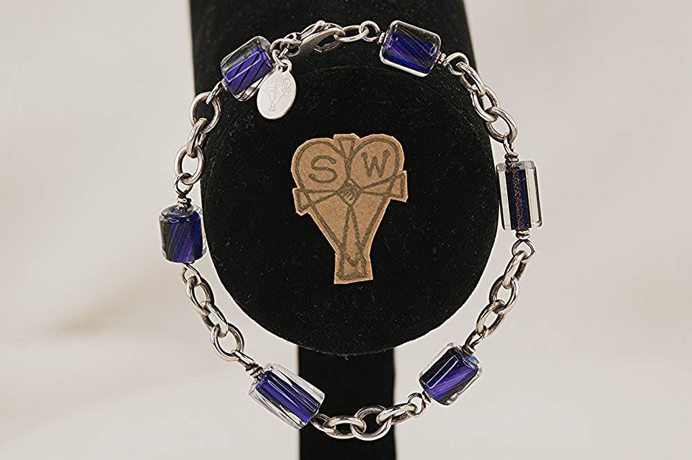 Bracelet hand made with purple and clear quartz crystal beads and sterling silver.