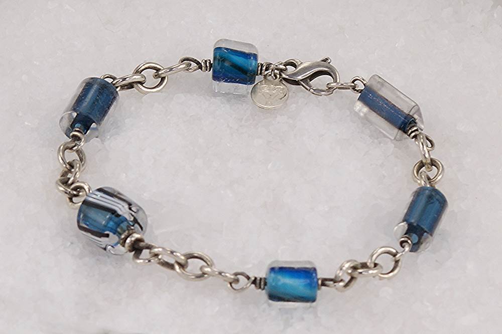 Handmade ocean blue bead bracelet with sterling silver chain and clasp.