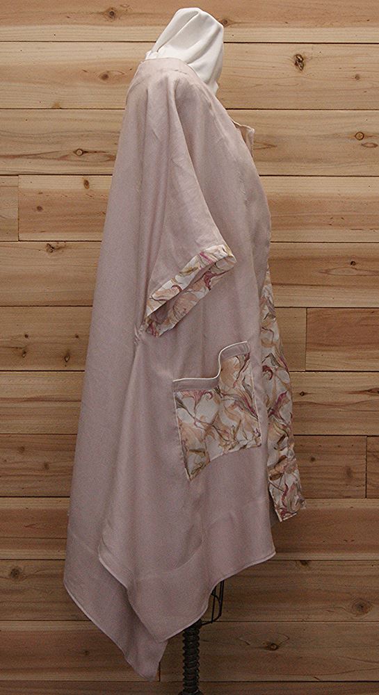 Chic cloak made of Australian linen with Pale pink an mauve flowered print and two large front pockets.