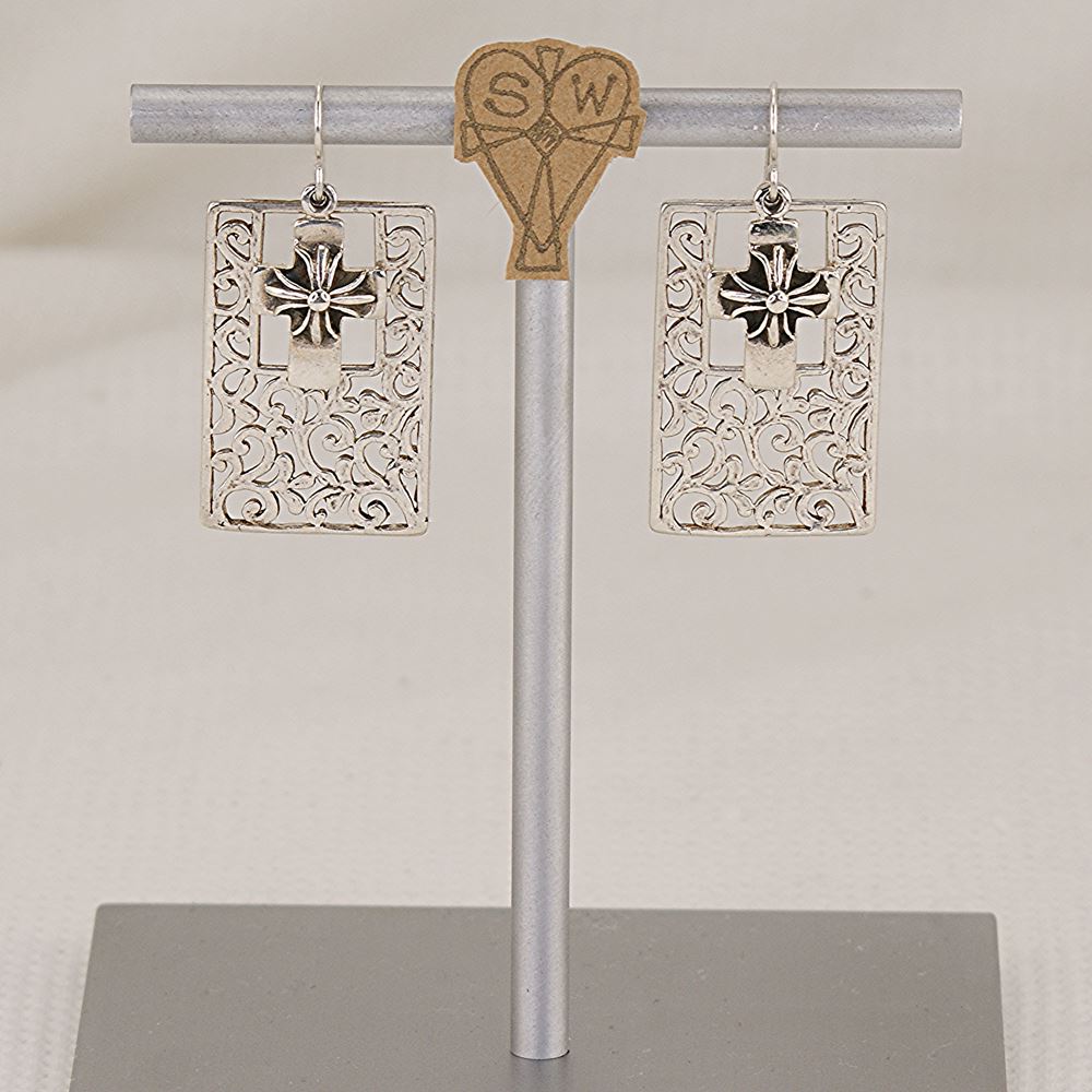 Handmade sterling silver scroll and cross earrings.
