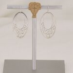 Handmade sterling silver scroll cut earrings.