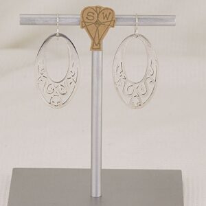 Handmade sterling silver scroll cut earrings.