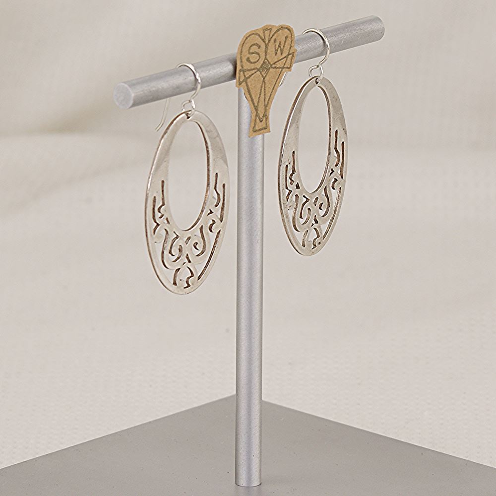 Earrings handmade of flat scroll cut sterling silver.