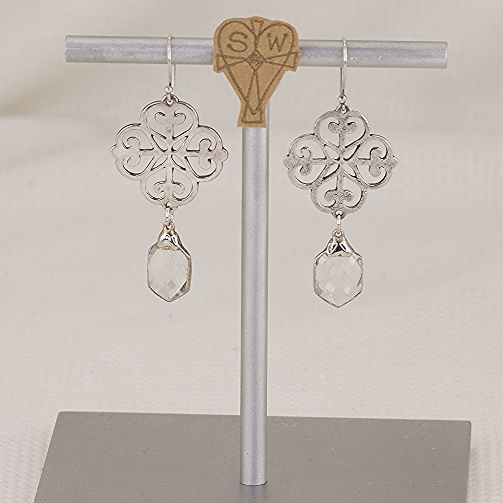 Handmade quatrefoil earrings made of scroll cut sterling silver and quartz crystal.