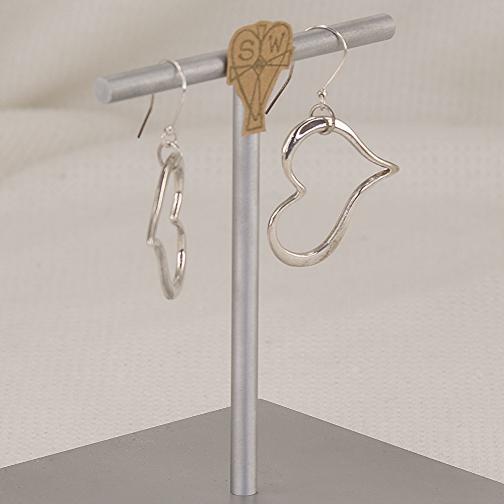 Handmade sterling silver dimensional heart earrings.