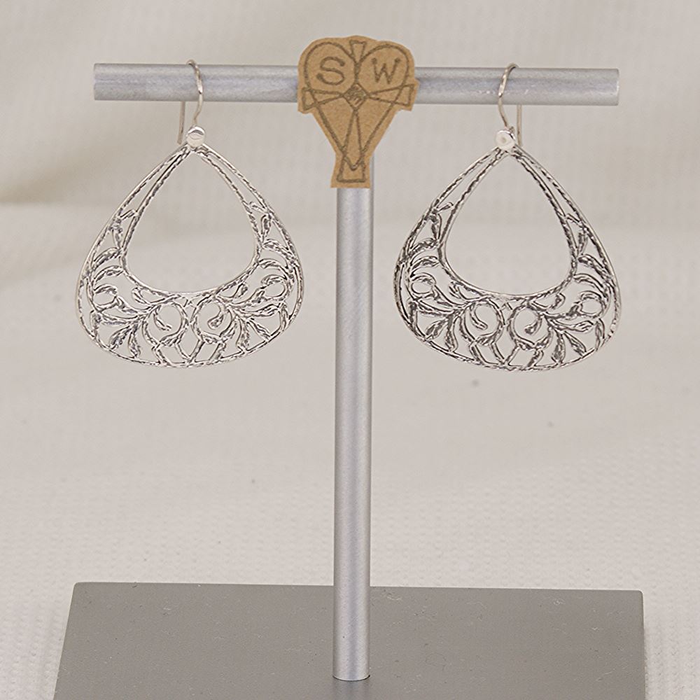 Handmade sterling silver scroll cut earrings.