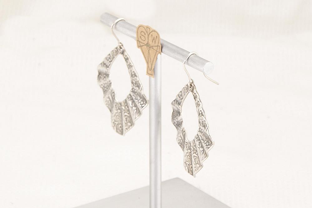 Sterling silver floral pleated earrings.