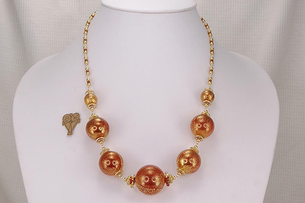 Red and gold leaf glass bead necklace with clear quartz discs.