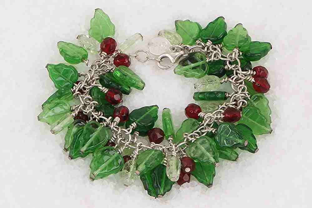 Red and green holly glass bead bracelet on sterling silver chain.