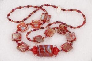 One of a kind red dichroic glass bead necklace.